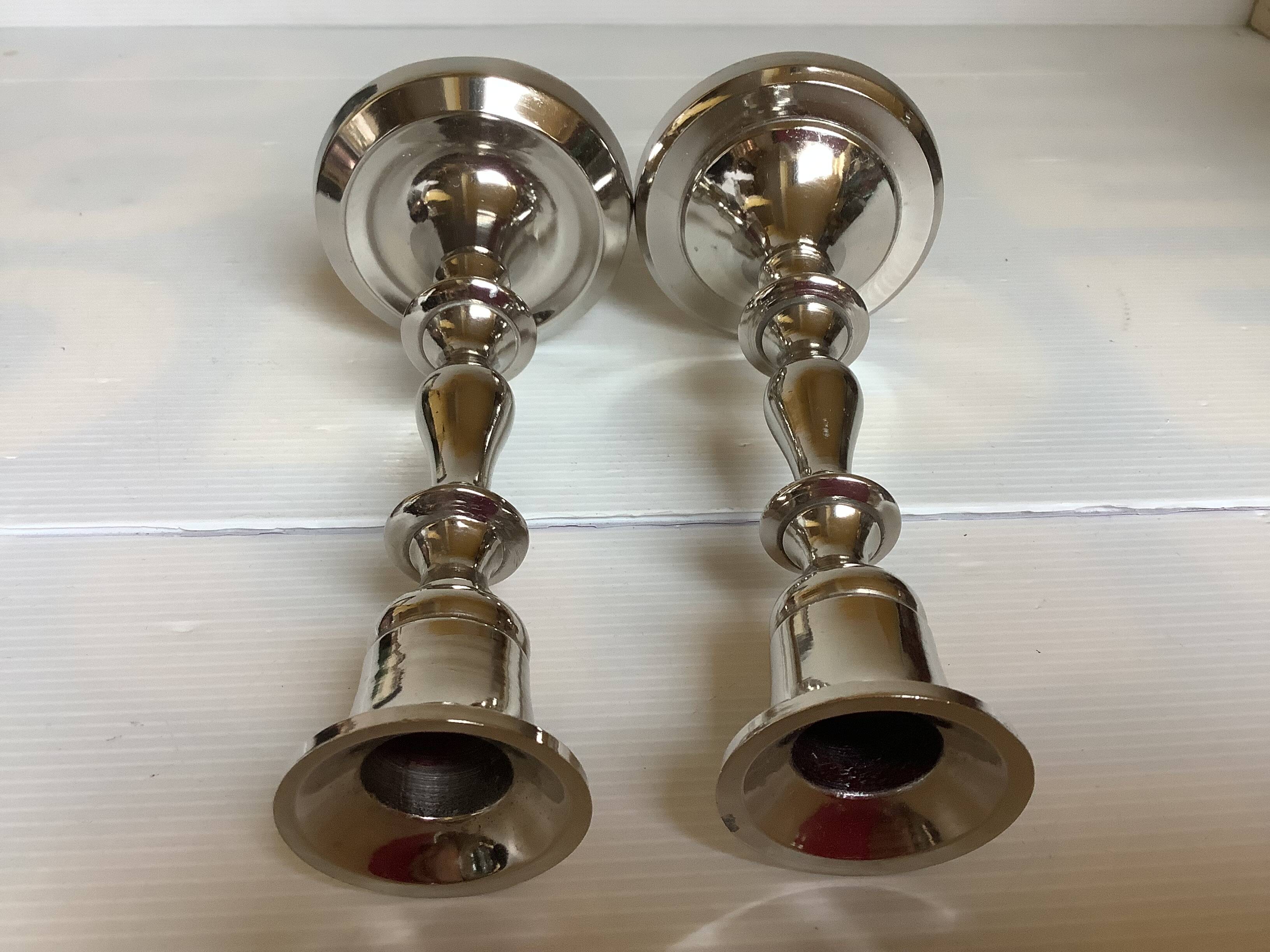 Pair of silver metal candlesticks