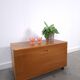 Vintage teak Danish chest with a lid on wheels, toy chest.