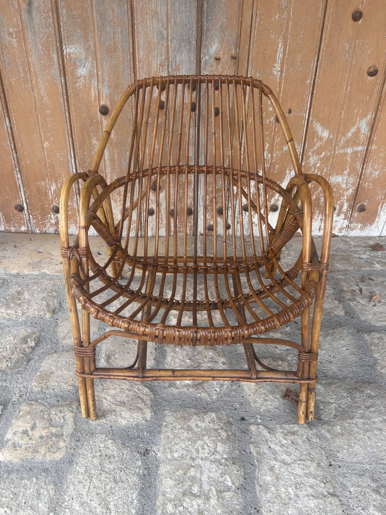 Pair of vintage rattan armchairs from the 1960s – a perfect timeless piece for indoors and outdoors.