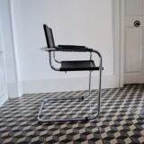 Vintage chrome and faux black leather armchair