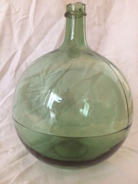 Demijohn old transparent green, estimated capacity around 12 to 15L