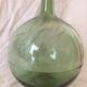 Demijohn old transparent green, estimated capacity around 12 to 15L