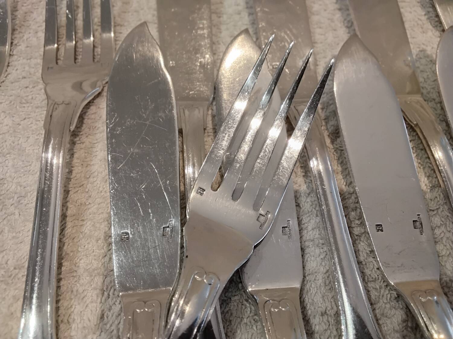 11 silver-plated fish forks and 11 fish knives by Christofle Vendome
