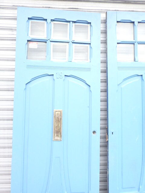 Double front door, fir and windows at the top