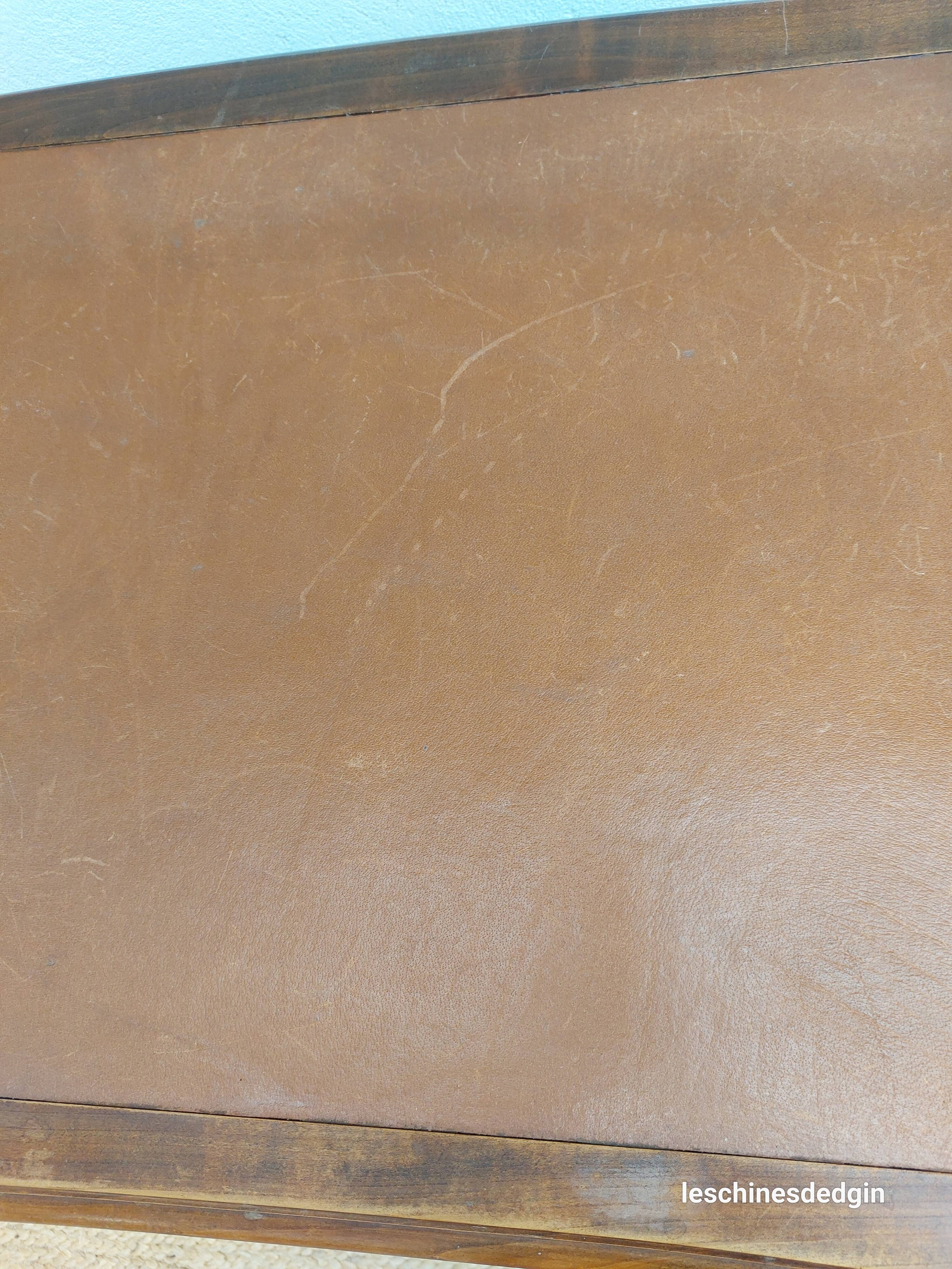 Louis XV style desk in wood, with a brown leather top.