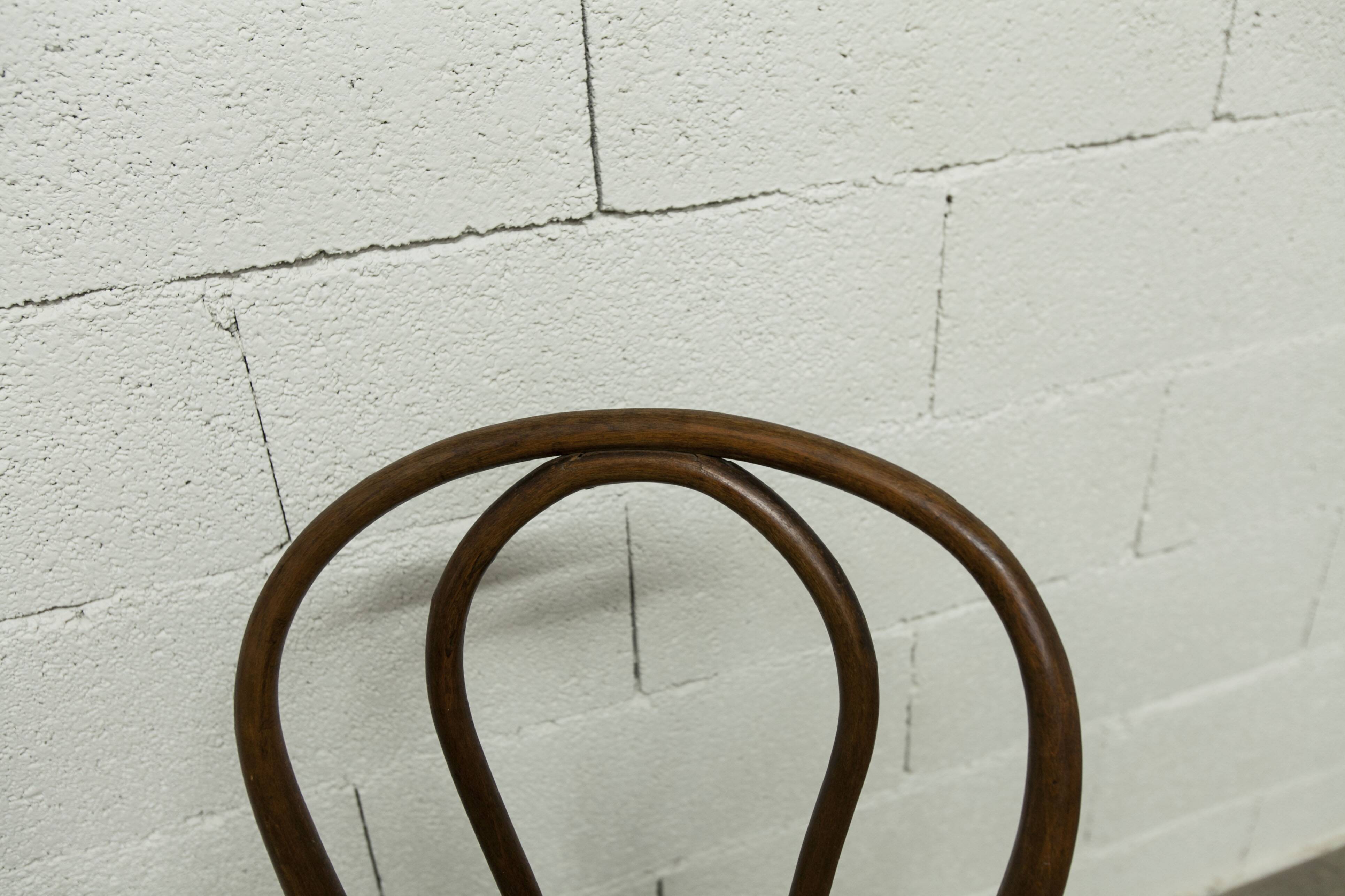 1920s curved wooden cane bistro chair