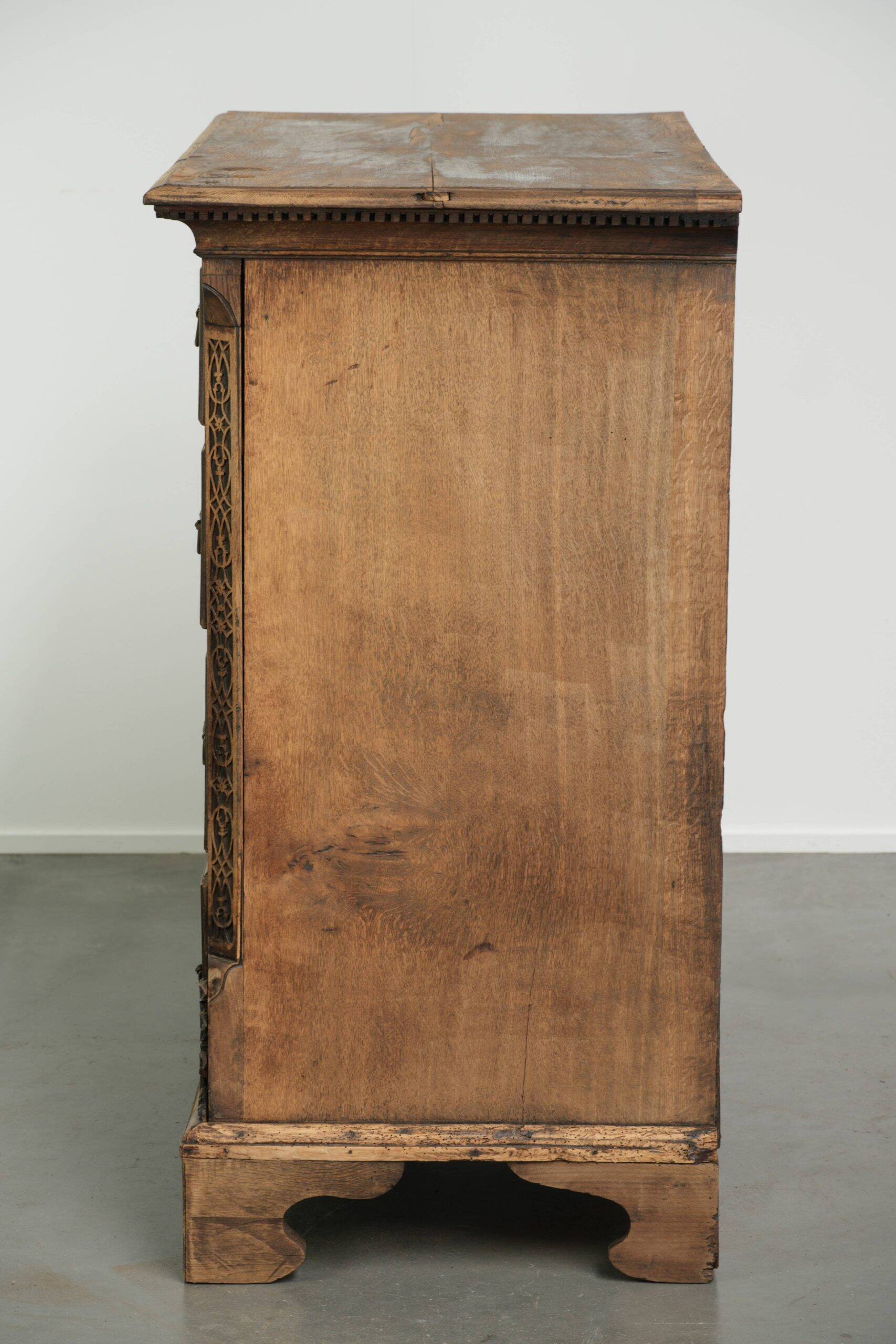 Richly carved English oak chest of drawers from the 18th century