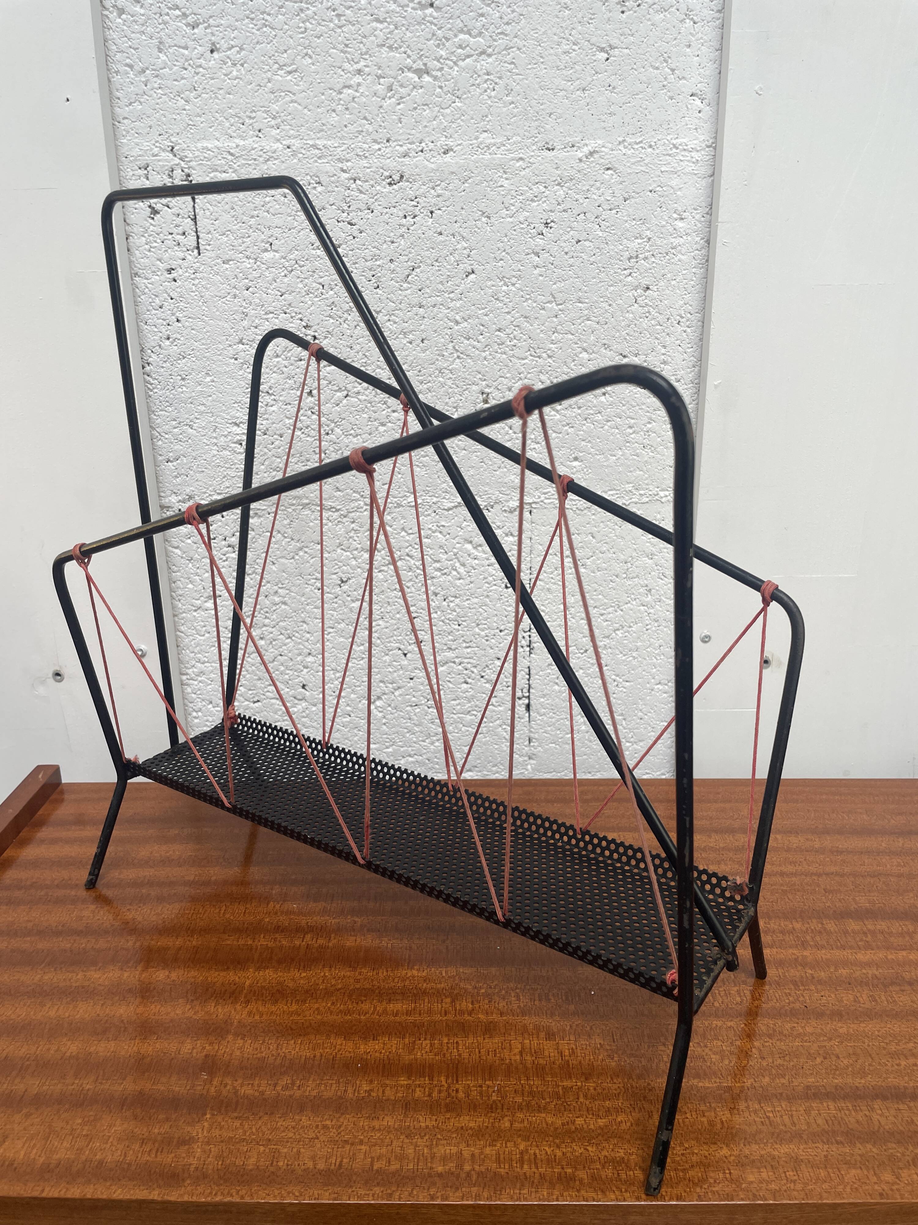 Vintage perforated metal magazine rack with cord handles by Matégot from the 1950s-60s.