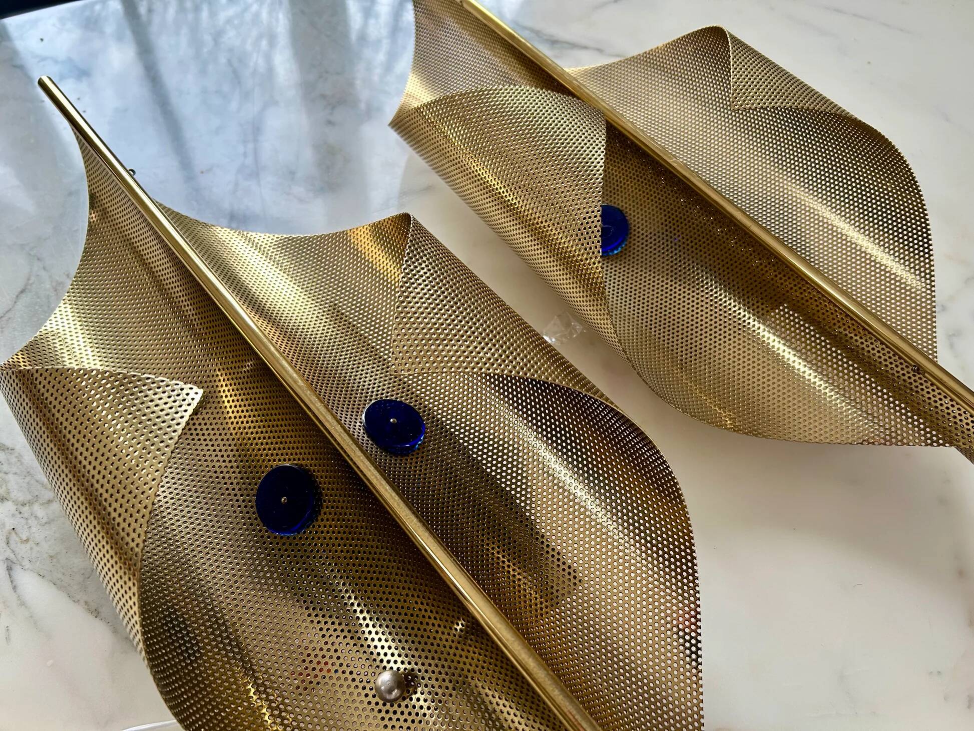 Pair of perforated brass wall lights by Christoph Palme, Germany, 1980s.