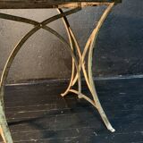 Ancient wrought iron and wood garden table