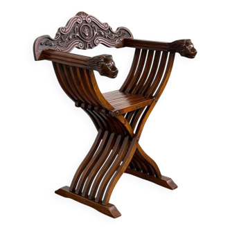 Fauteuil pliant vintage en bois sculpté