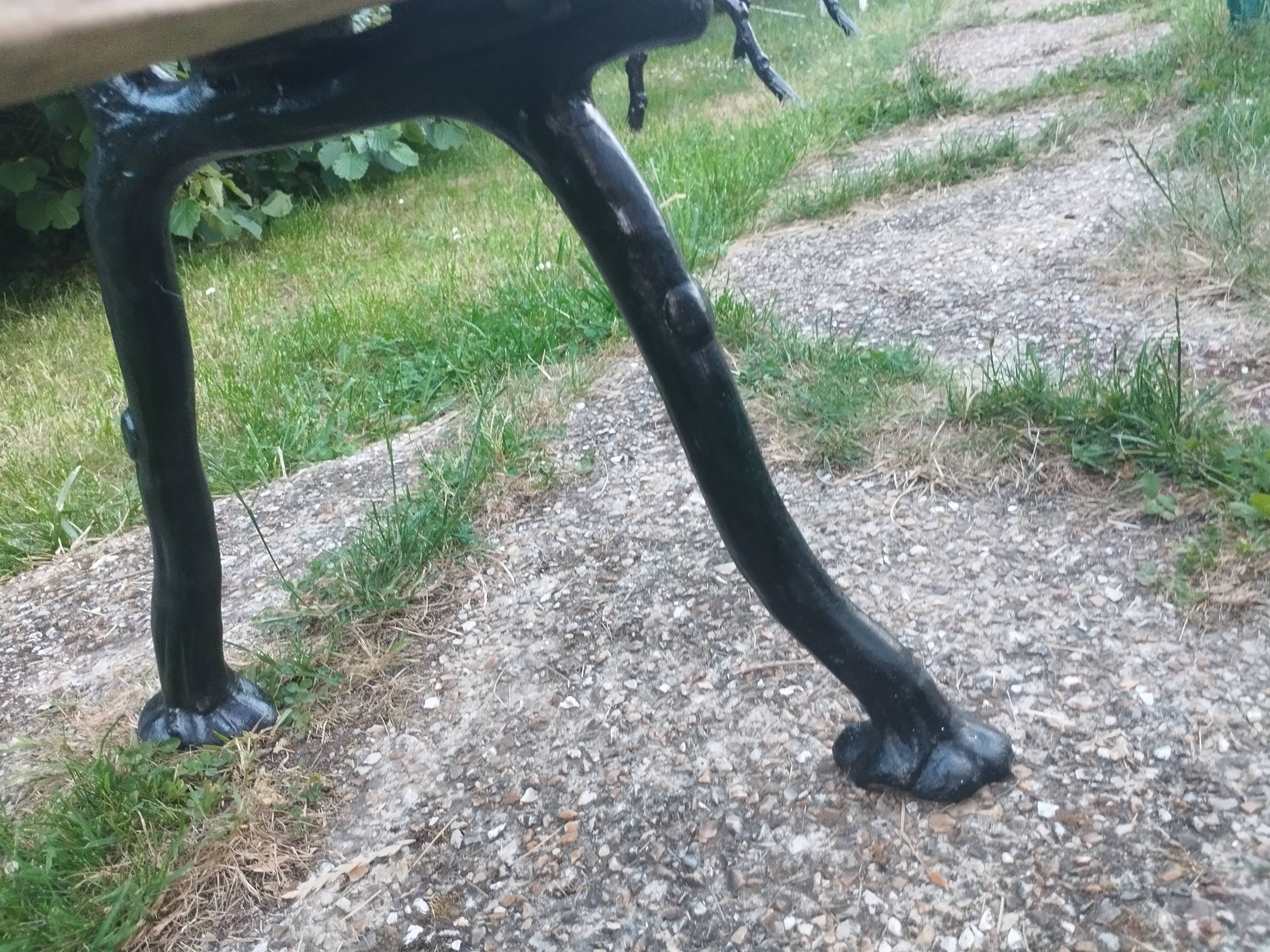 Antique garden bench with cast iron legs