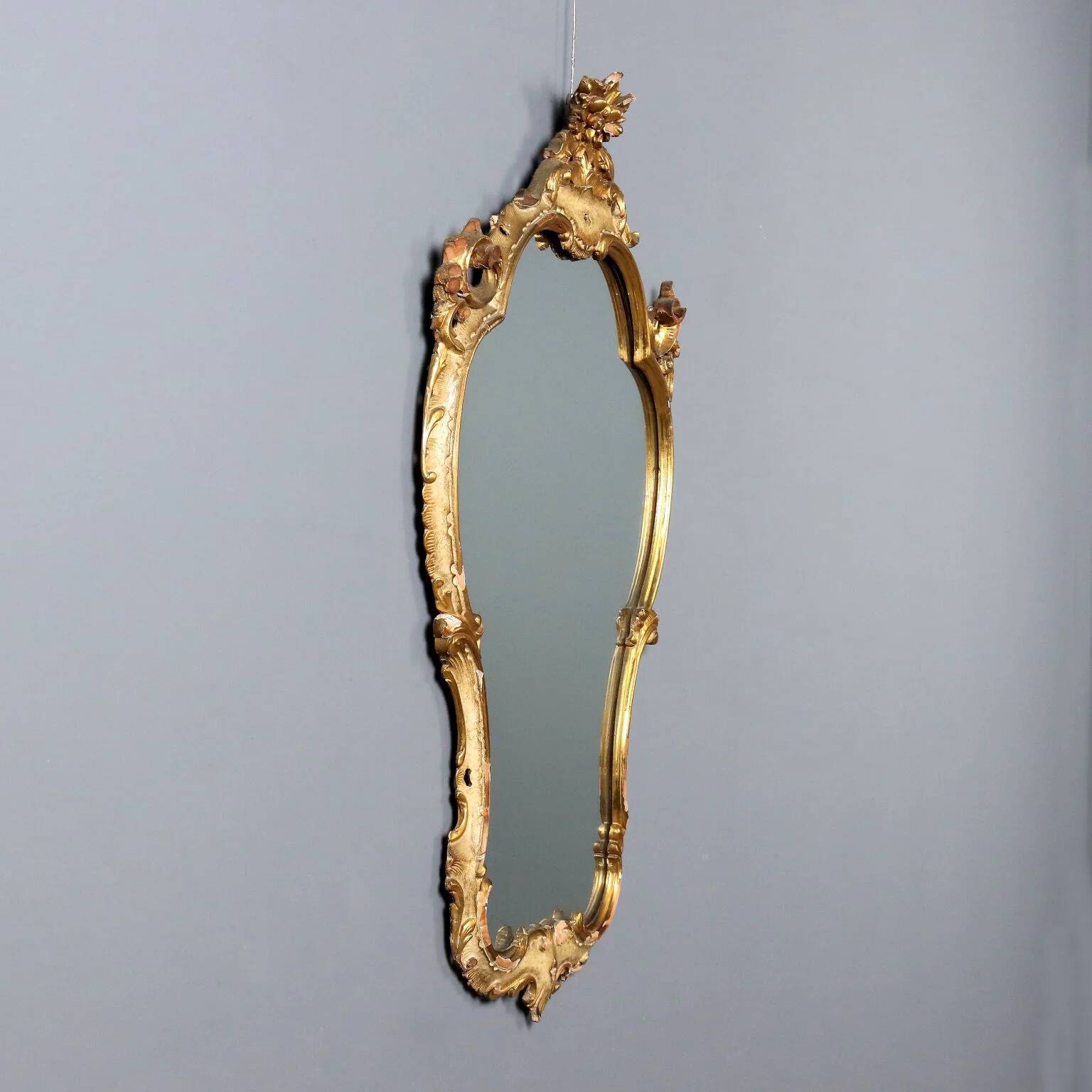 Antique baroque-style mirror in carved wood, Italy, 19th century.