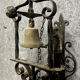 Wrought iron entrance bell depicting a monk ringing a bell circa 1900-1930