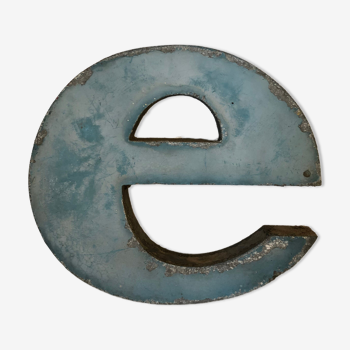 Blue sign letter "E"