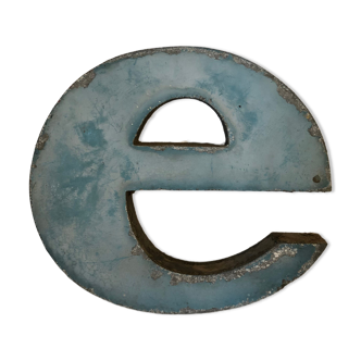 Blue sign letter "E"