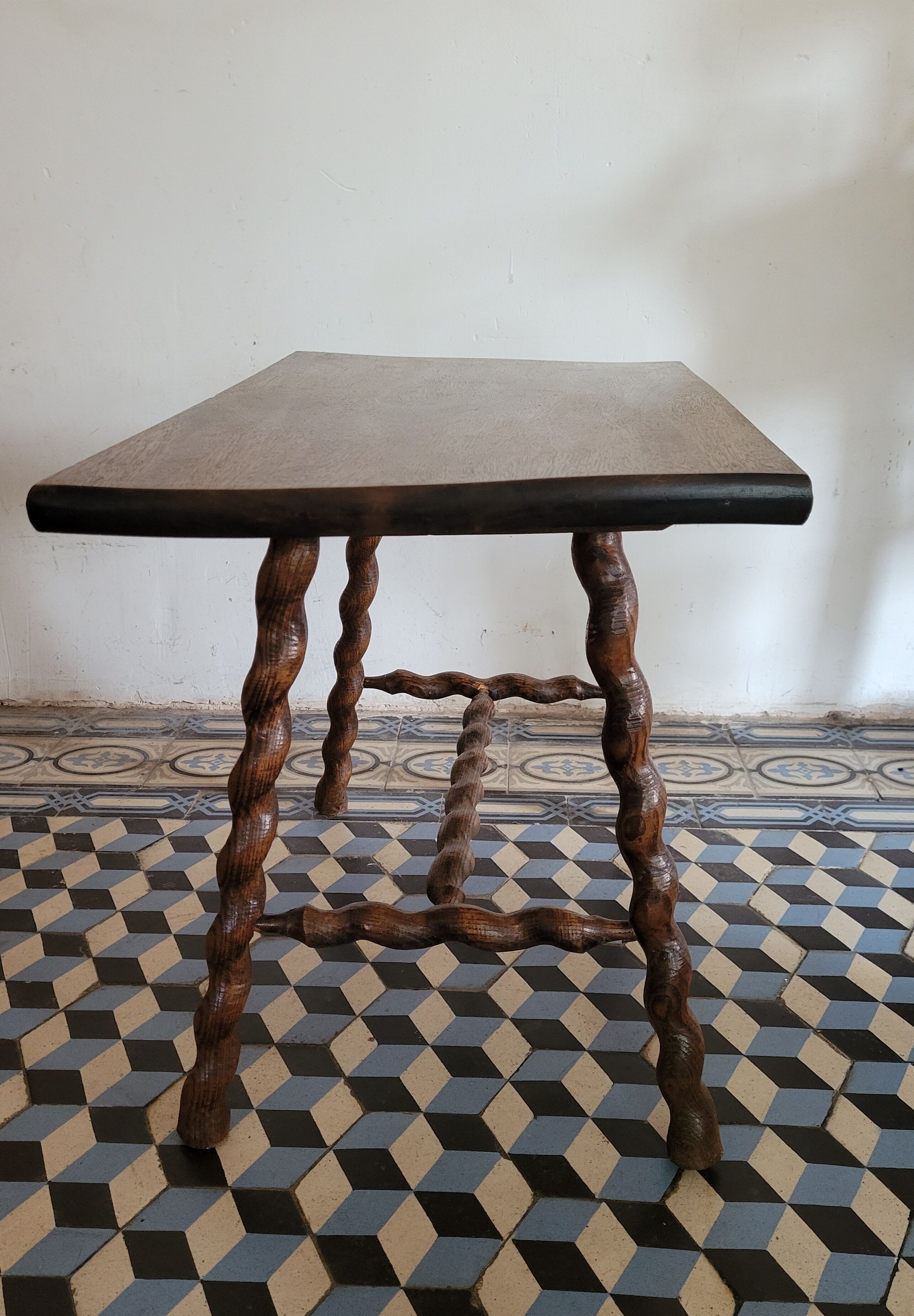 Brutalist coffee table with turned wooden legs