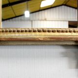 Miroir en bois doré, style Louis XVI – 1ère partie XXe - 60x30cm