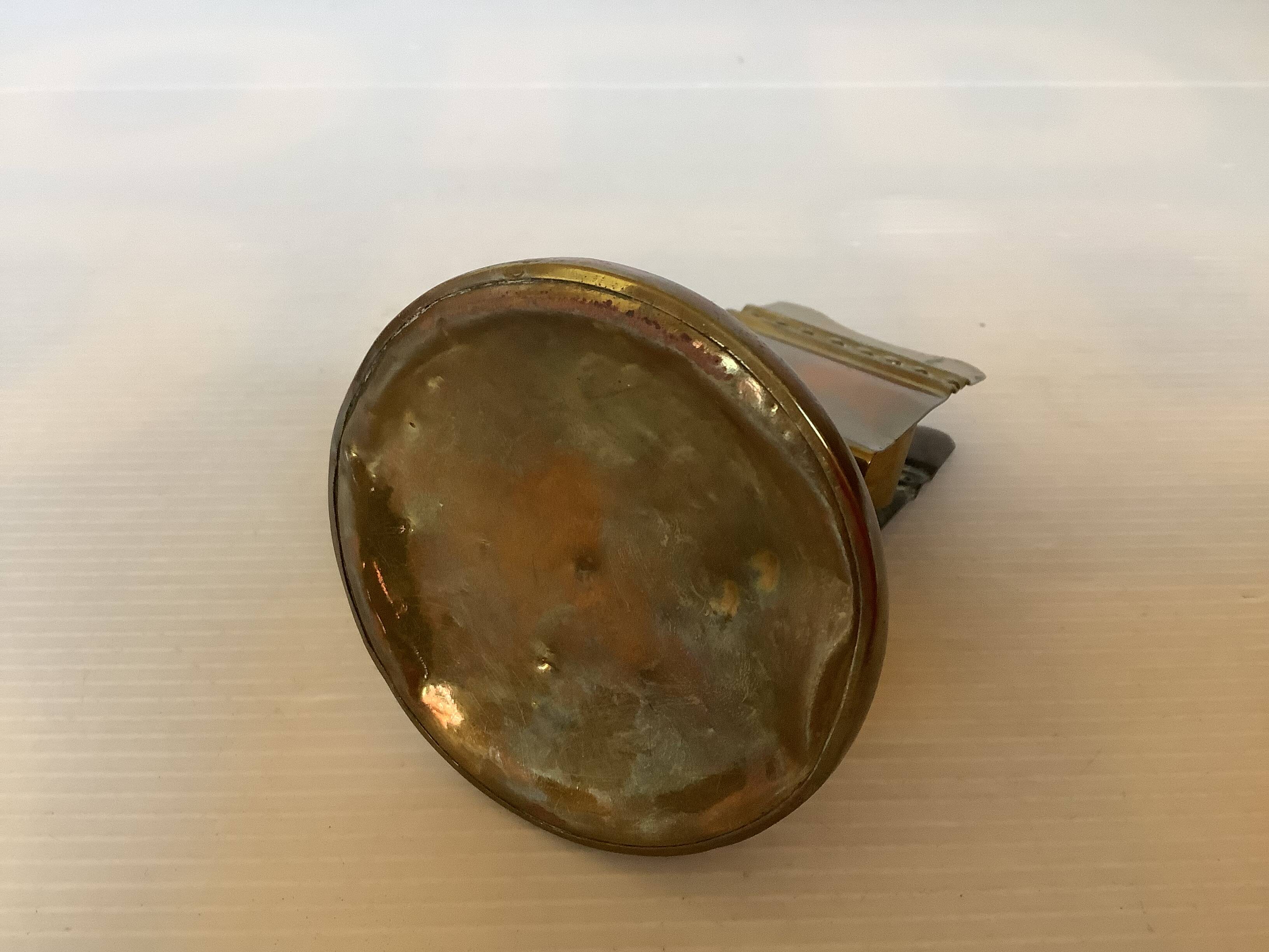 Antique brass match holder with tulip base.