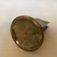 Antique brass match holder with tulip base.