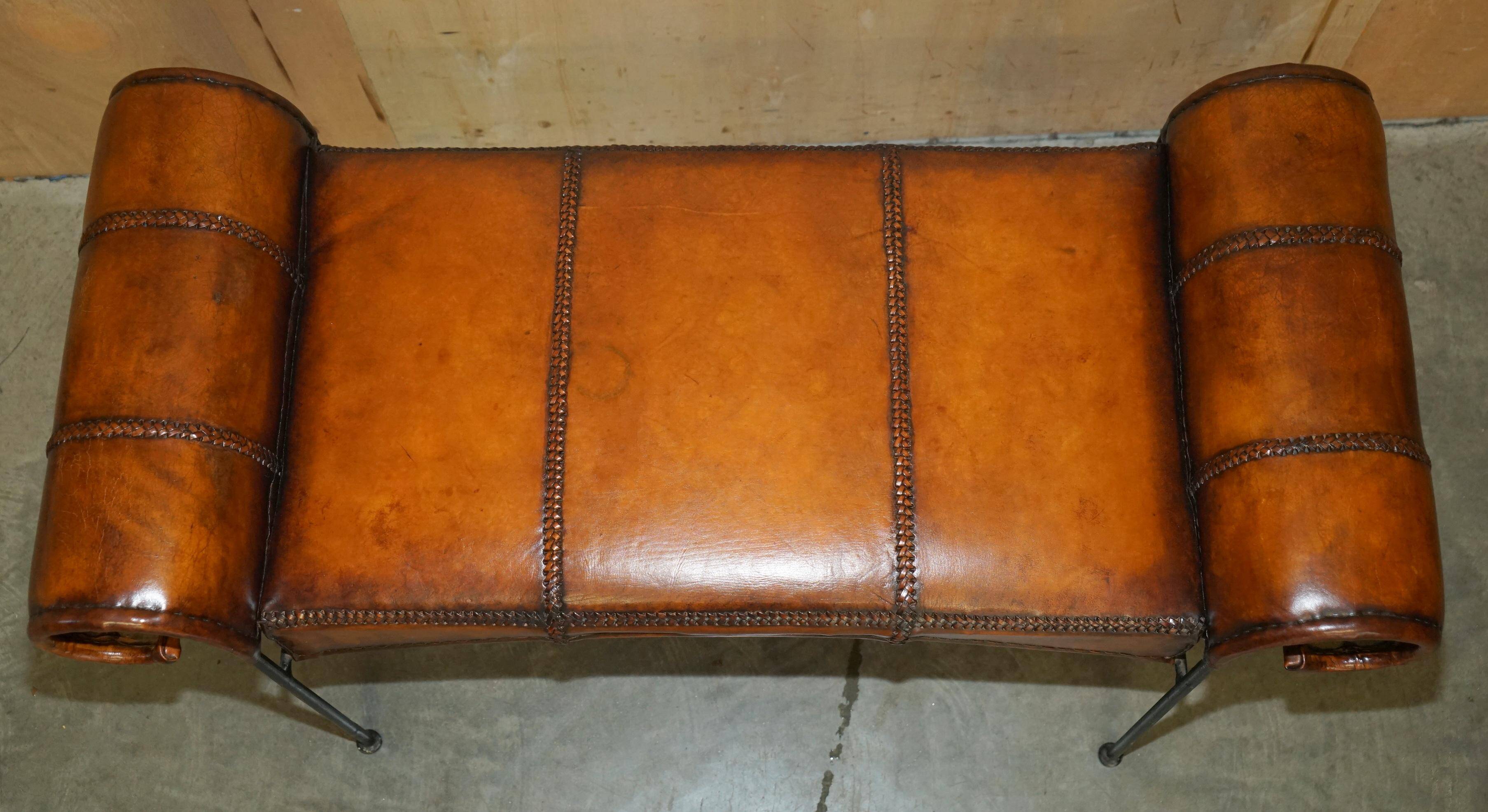 Vintage Spanish window bench in hand-stitched leather and restored iron.