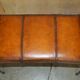 Vintage Spanish window bench in hand-stitched leather and restored iron.