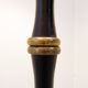 Tripod floor lamp in wrought iron and brass with bamboo-style base.