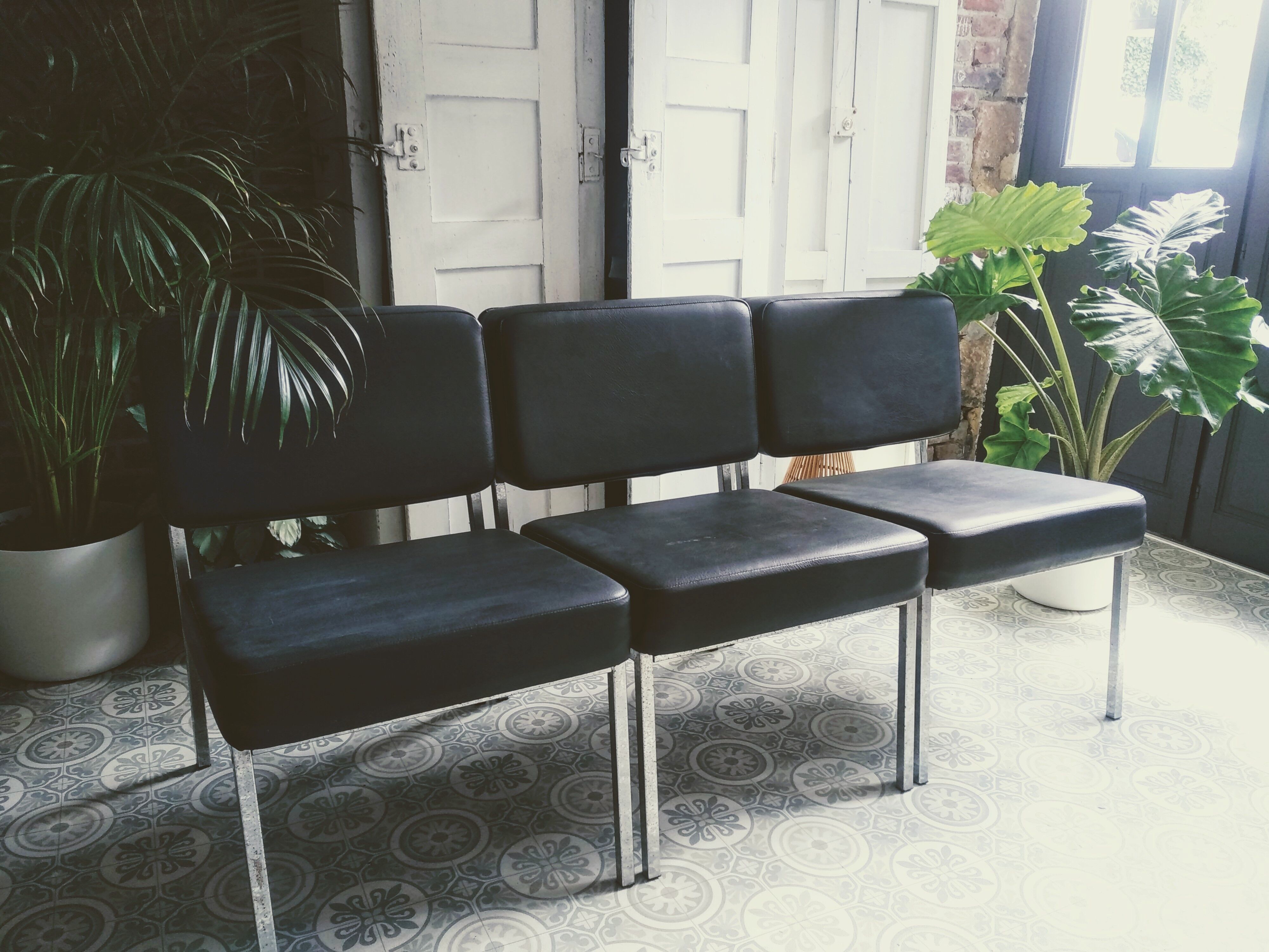 3 black armchairs