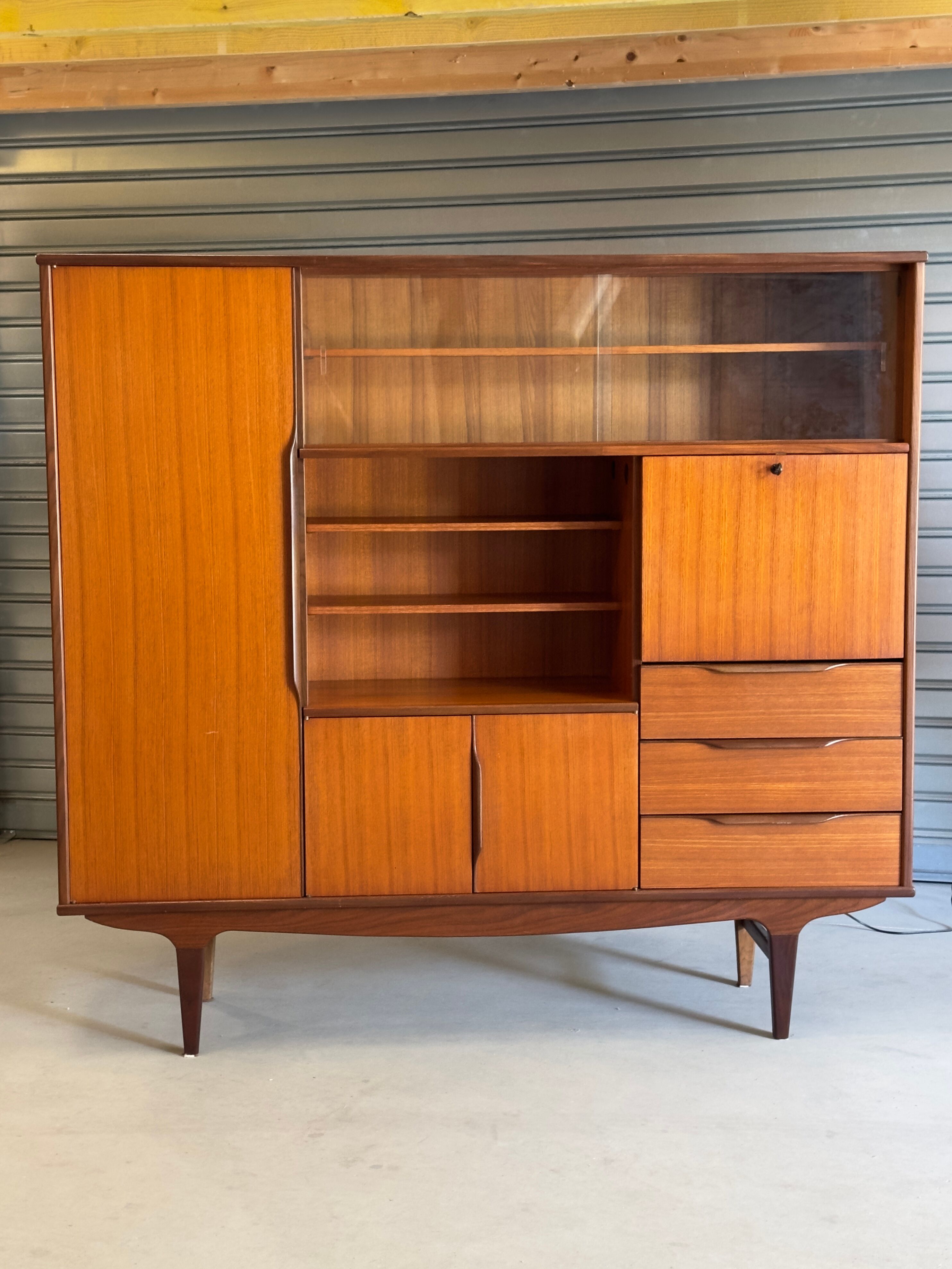 Very beautiful Scandinavian highboard in teak from the 1960s.