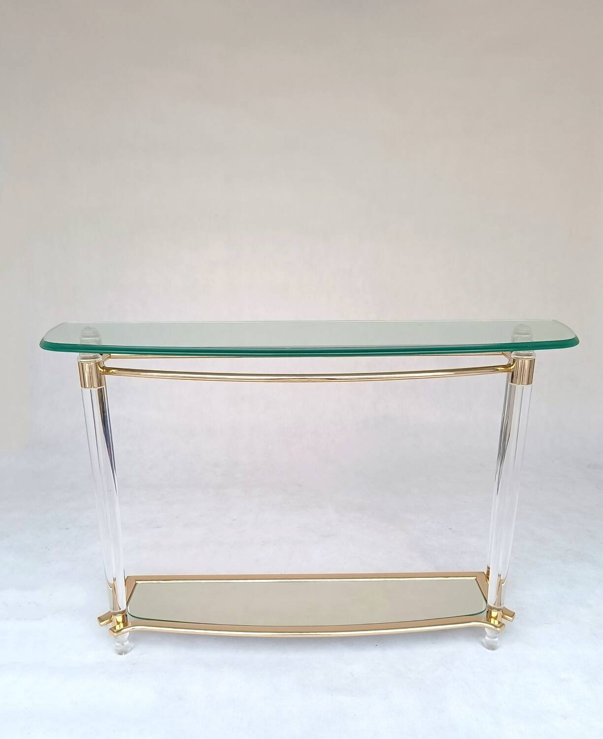Hollywood Regency console table in lucite, glass and gold metal. 1980s