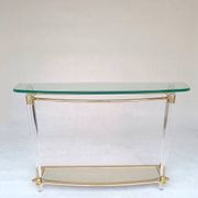 Hollywood Regency console table in lucite, glass and gold metal. 1980s
