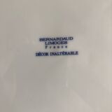 Round Limoges Bernardaud porcelain dish with floral frieze and sticks