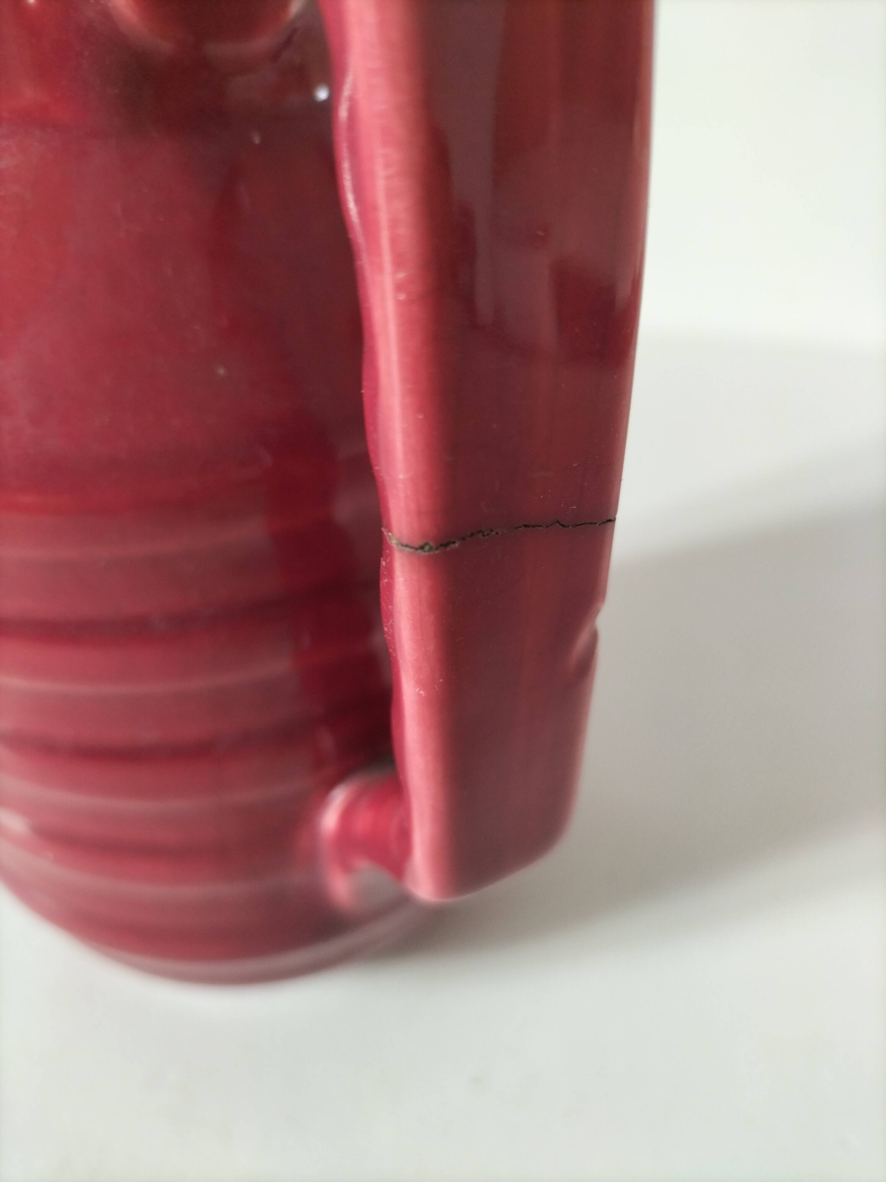 Old raspberry red pitcher from Onnaing, early 20th century.