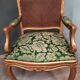 Louis XV-style golden armchair pair