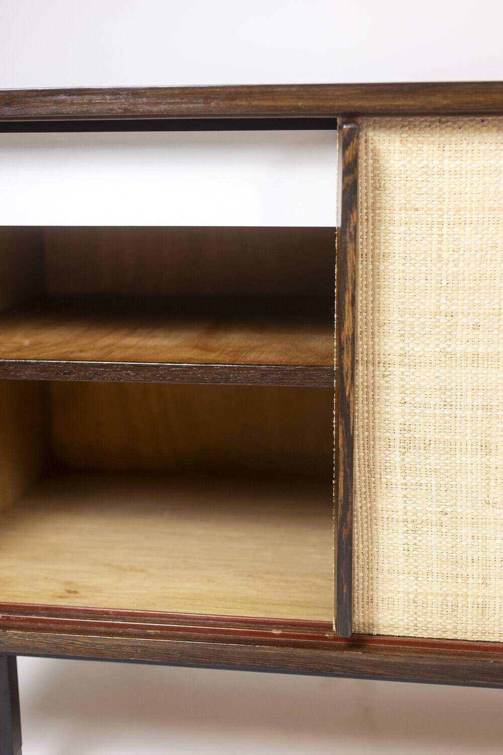 Sideboard in wenge, raffia and lacquered metal. 1970s.