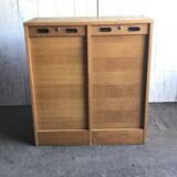 Mid-century industrial haberdashery cabinet in brown oak, double tambour, 1950s.
