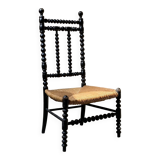Low chair in turned wood