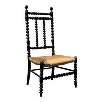 Low chair in turned wood