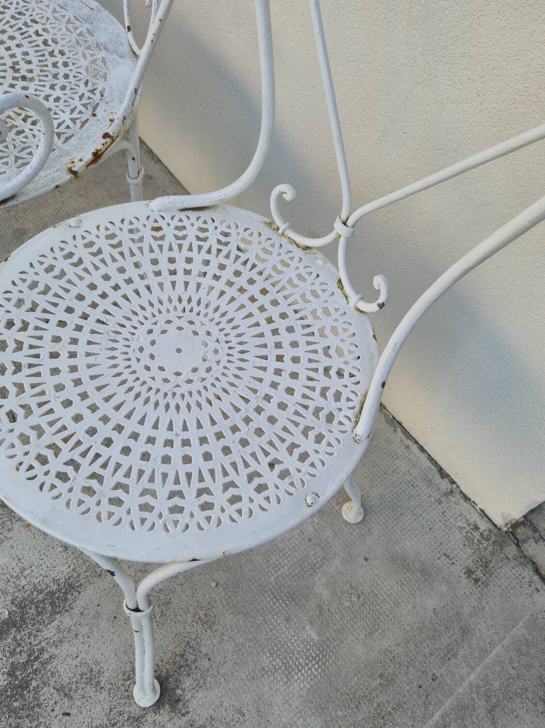 Garden furniture, two armchairs and two wrought iron chairs, period 1