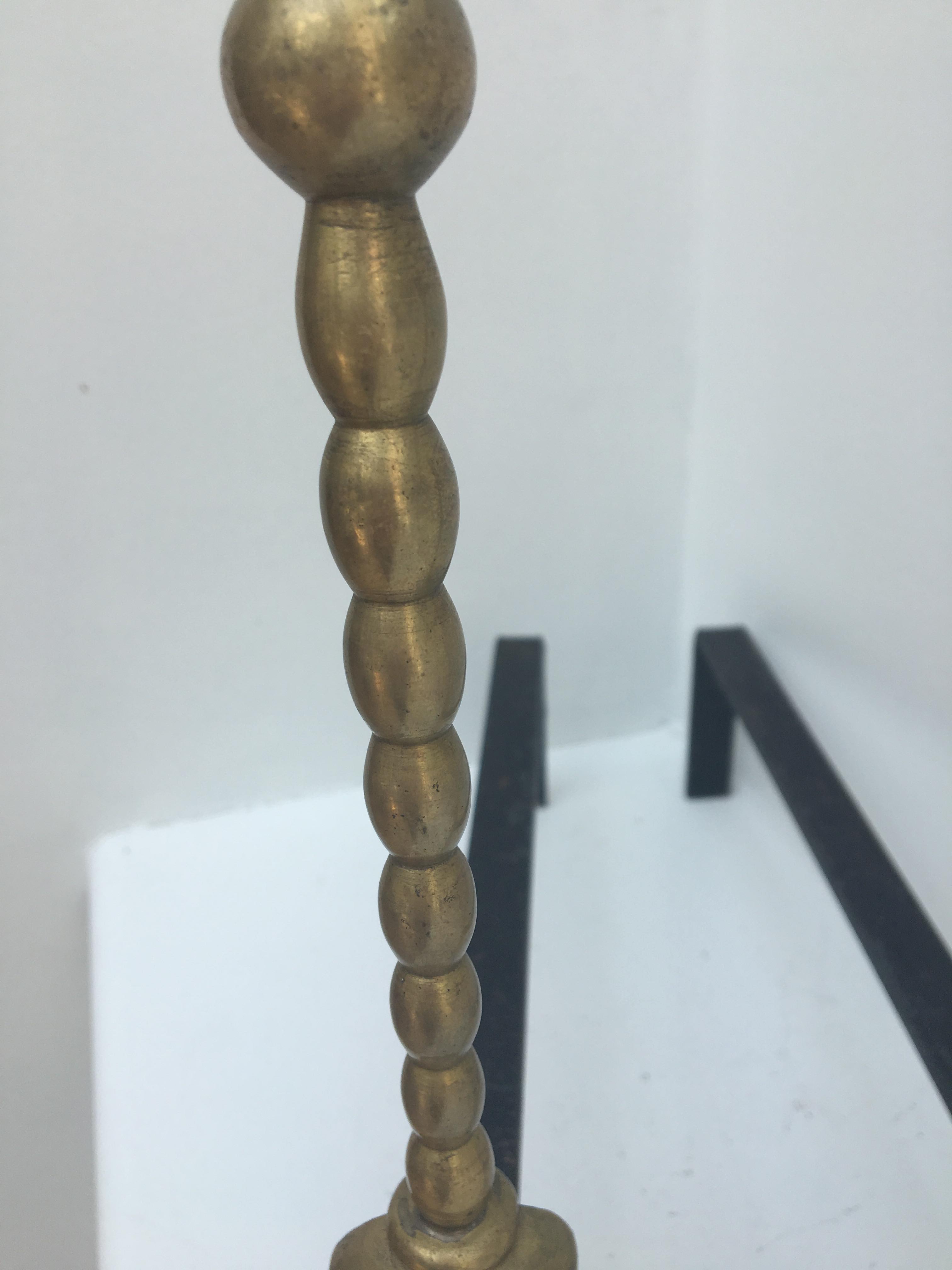 Pair of andirons in brass for fireplace