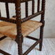 Fauteuil de coin paillé