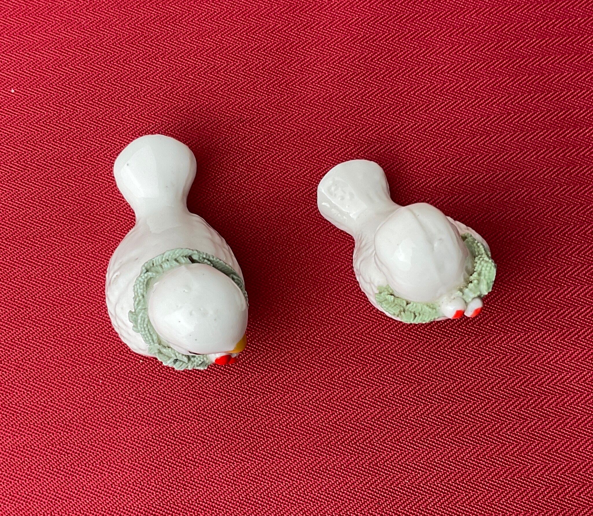 Pair of miniature white birds in ancient ceramics