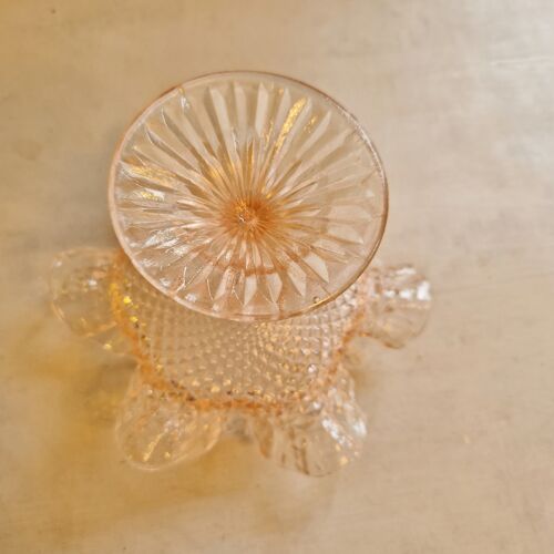 Small antique cup on foot in chiseled pink glass