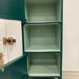 Two-door green bedside table