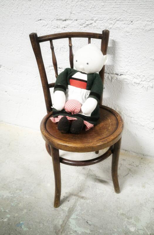 Antique children's chair in curved wood