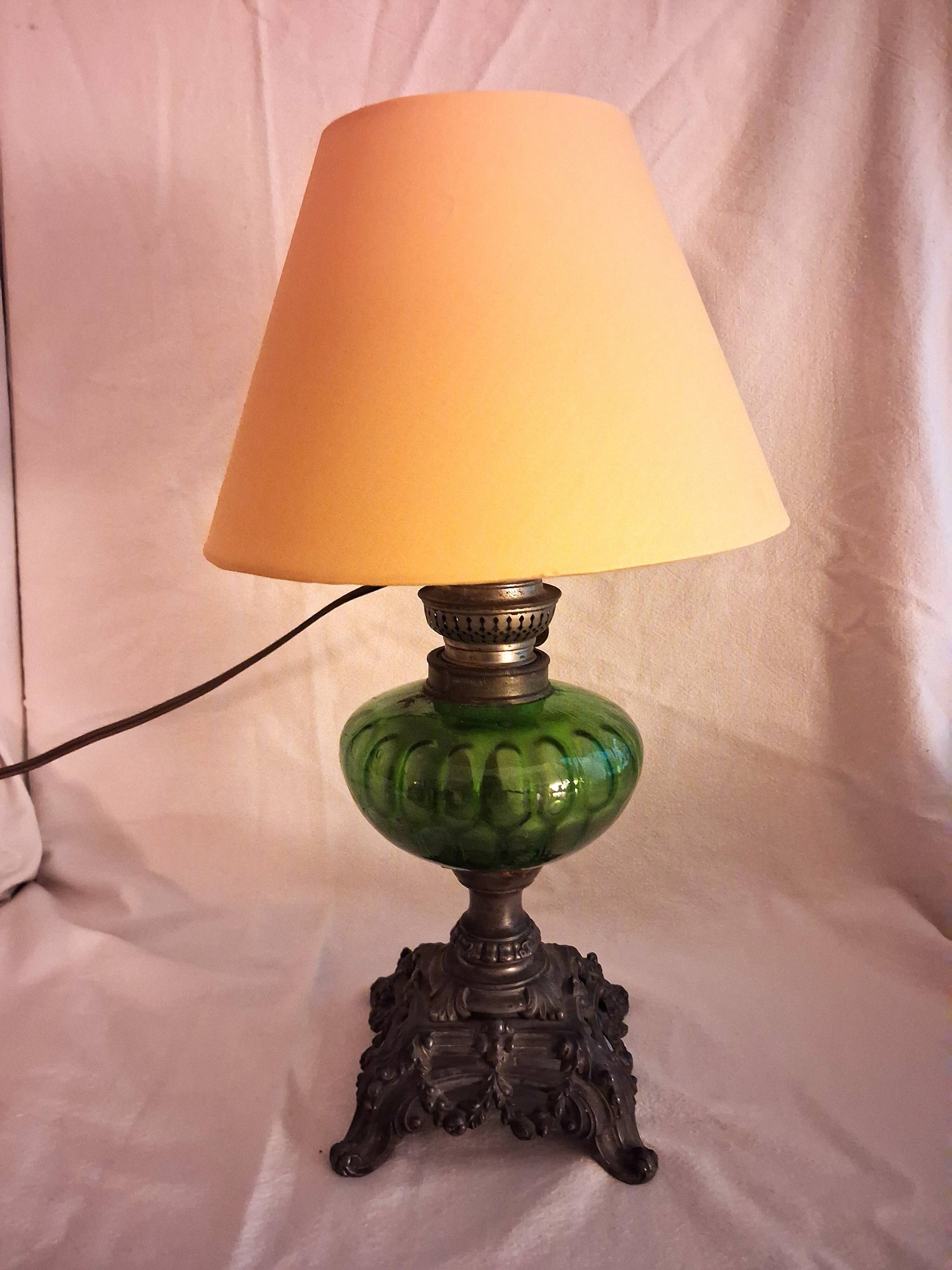 Antique oil lamp with lampshade, for table use.
