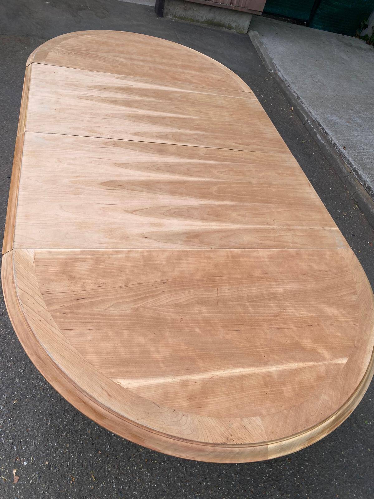 Round extendable farmhouse dining table, stripped, Louis XIII style from the 1960s.
