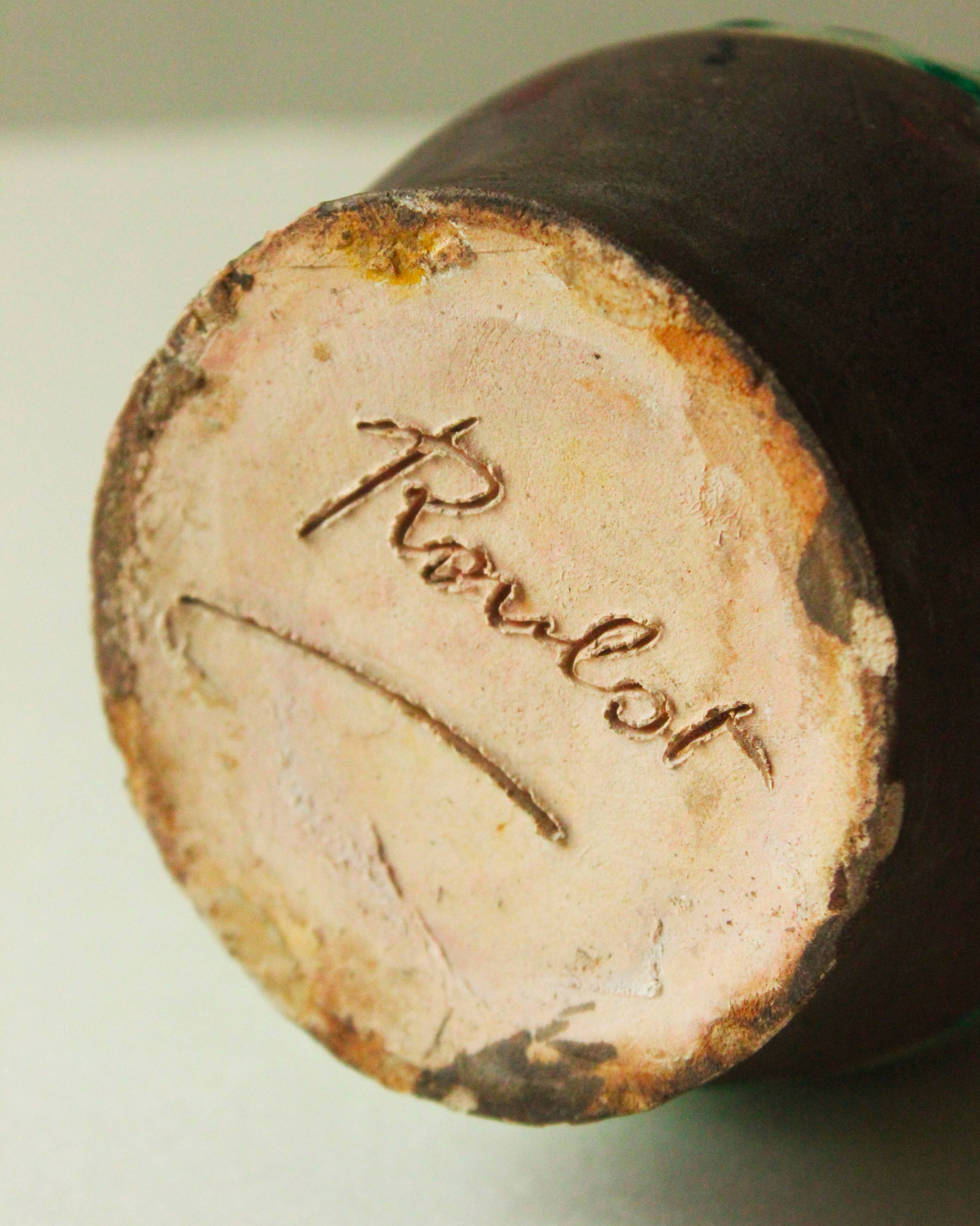 Glazed ceramic pitcher in green and brown by the potter Pierre Roulot.