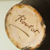 Glazed ceramic pitcher in green and brown by the potter Pierre Roulot.