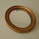 Small vintage oval mirror in gilded resin from the 60s/70s.